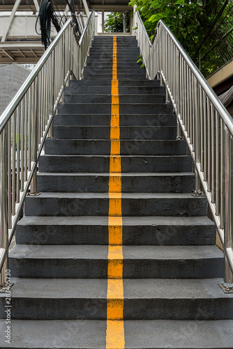 Yellow line and stairs.