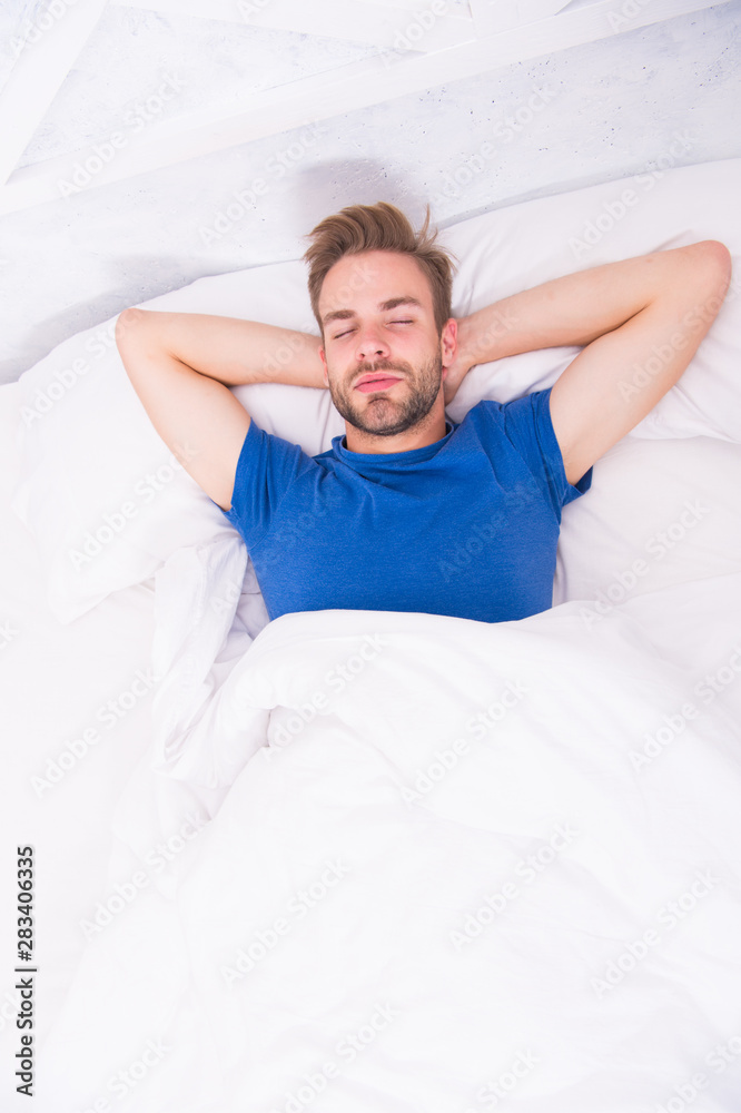 Relaxing before fall asleep. Get enough amount of sleep every night. Bearded man face relaxing. Maintaining consistent circadian rhythm essential for general health. Man handsome guy relaxing in bed Relaxing before fall asleep. Get enough amount of sleep every night. Bearded man face relaxing. Maintaining consistent circadian rhythm essential for general health. Man handsome guy relaxing in bed