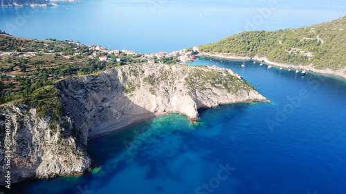Aerial drone bird's eye view photo of beautiful and picturesque colorful traditional fishing village of Assos in island of Cefalonia, Ionian, Greece © aerial-drone