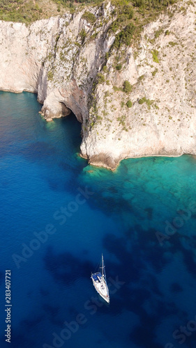 Aerial drone photo of tropical caribbean bay with white sand beach and beautiful turquoise and sapphire clear sea