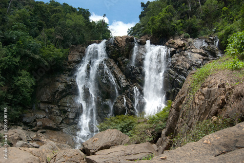 beautiful waterfalls with trees and sky