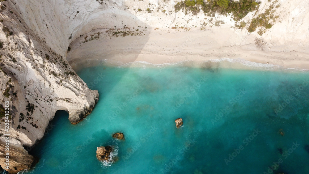 Aerial drone photo of tropical caribbean turquoise bay with large volcanic white cliffs and beautiful emerald sea