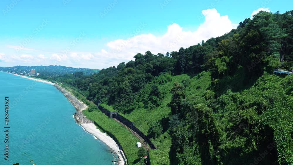 Aerial view. Beautiful blue sea and mountains in Georgia, Batumi. Amazing tropical beach. Video of tropical paradise coast with turquoise and sapphire clear waters. 4K shot Aerial view. Beautiful blue sea and mountains in Georgia, Batumi. Amazing tropical beach. Video of tropical paradise coast with turquoise and sapphire clear waters. 4K shot