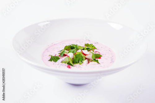 Cold borscht (chlodnik) - traditional Lithuanian cold soup with radish, parsley and dill