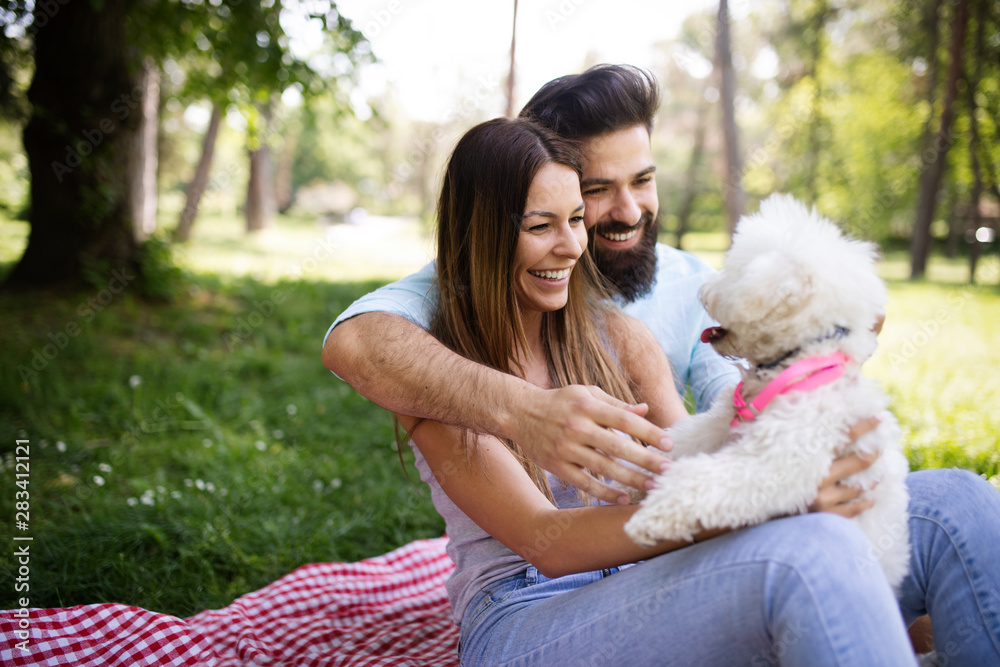 Couple in love enjoying picnic time outdoors Couple in love enjoying picnic time outdoors