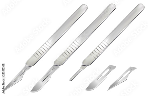 Billede på lærred Scalpels with blades, a handle without a blade and removable blades