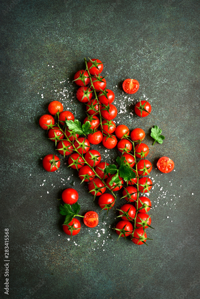 Fresh ripe cherry tomatoes on a bunchs. Top view with copy space. Fresh ripe cherry tomatoes on a bunchs. Top view with copy space.