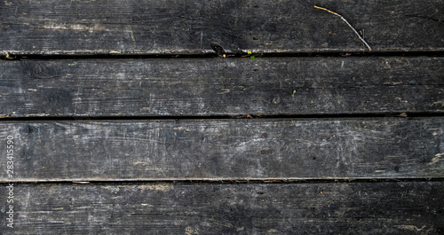 Wooden dark old dryly floor close up background texture photo