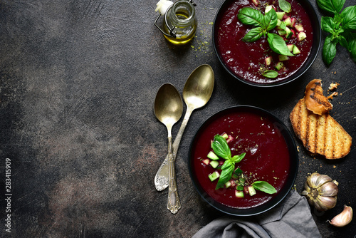 Fototapeta Naklejka Na Ścianę i Meble -  Cold summer beetroot soup with fresh cucumber ( gazpacho ) . Top view with copy space.