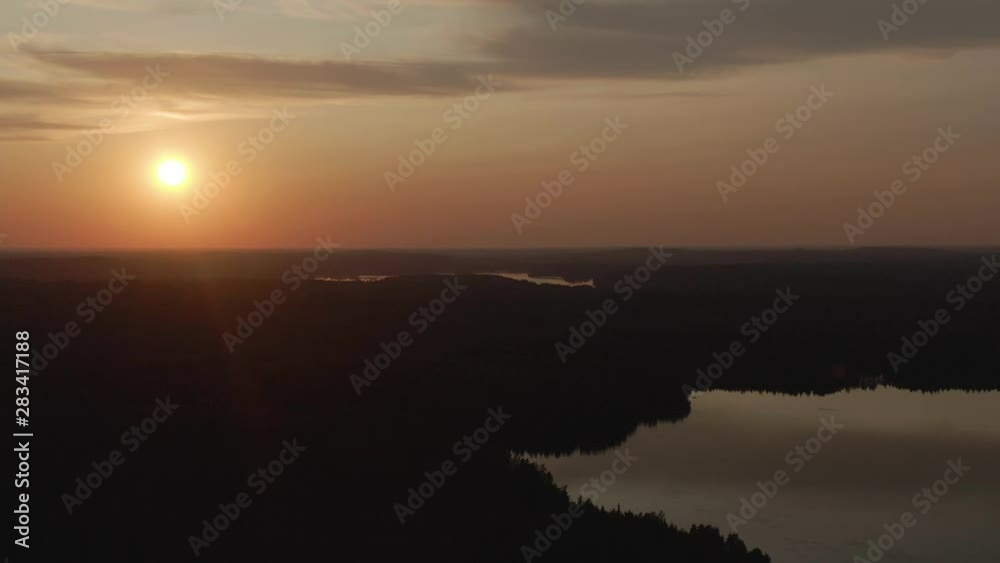 Sunset view. Drone shot of landscape with lake. Golden sky and horizon. Reflection in the water. Nature. Dark. Sunset view. Drone shot of landscape with lake. Golden sky and horizon. Reflection in the water. Nature. Dark.