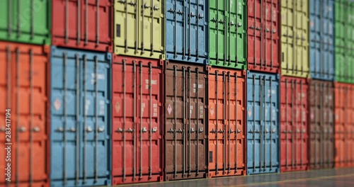 Rows of cargo shipping containers filmed by long focus camera. Multi-colored cargo shipment containers of different delivery cargo transportation companies. Seamless loopable animation.