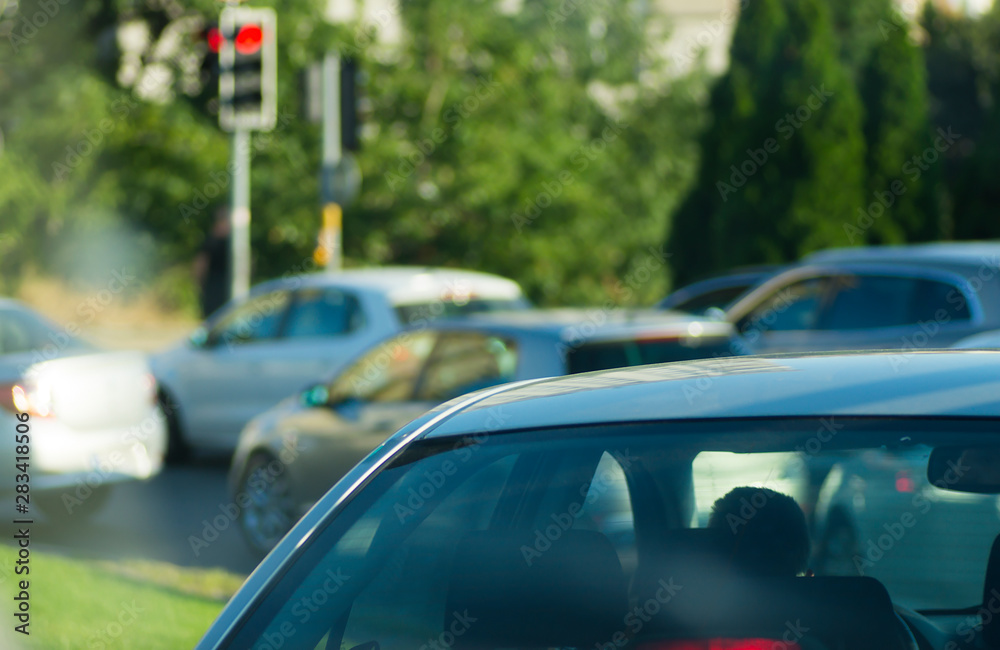 Cars waiting in traffic light at a crossroad in İstanbul, crowded heavy traffic during red light waiting for green light