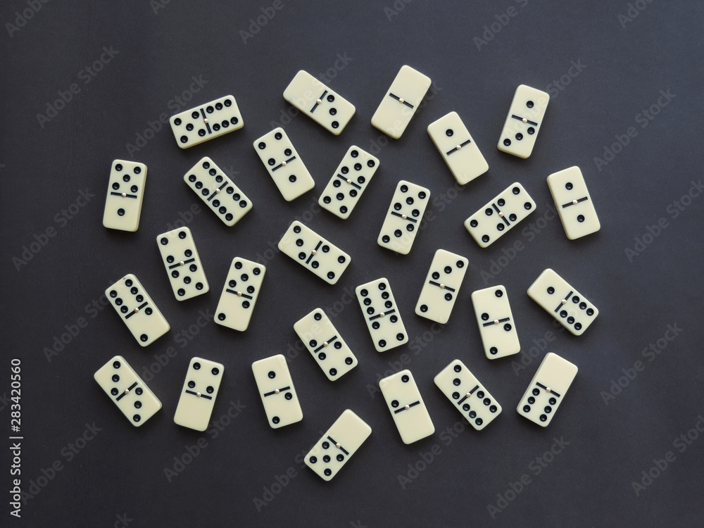 A set of domino pieces on dark background A set of domino pieces on dark background