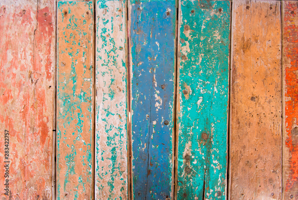 Wall composed of multi-colored wooden boards Wall composed of multi-colored wooden boards