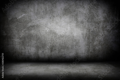 Grunge interior room with concrete wall and floor. Empty concrete space.