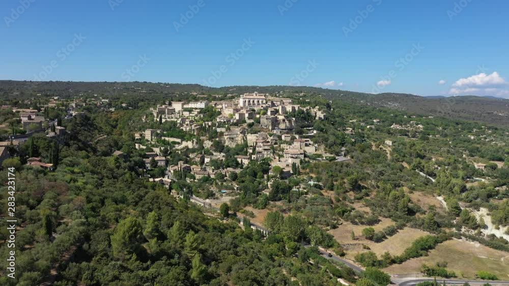 Famous village Gordes natural regional park Luberon aerial view sunny day hotels spa and historical city Famous village Gordes natural regional park Luberon aerial view sunny day hotels spa and historical city