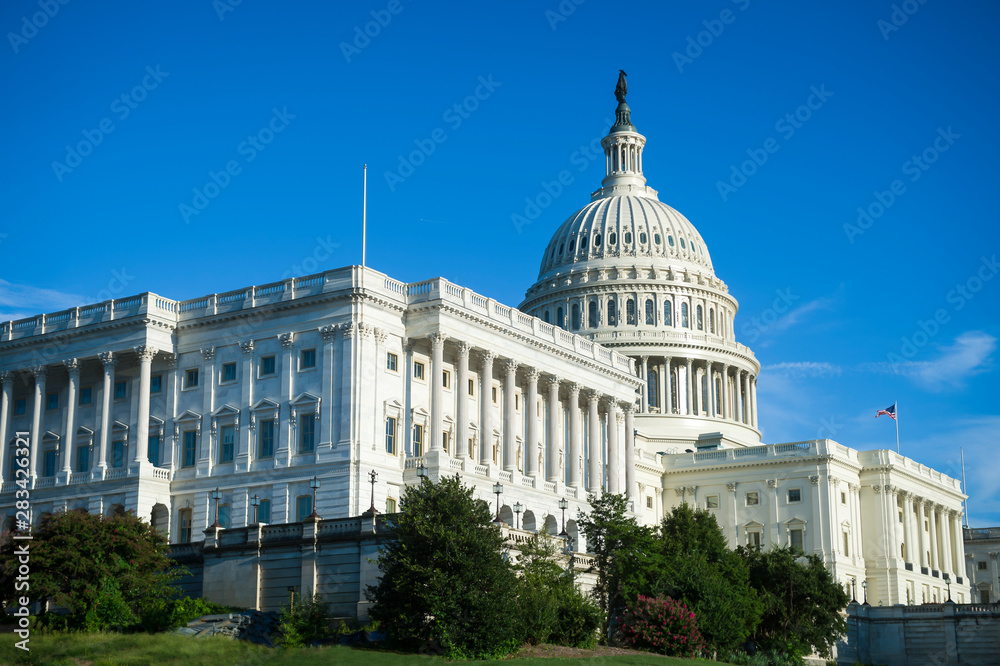 Scenic blue sky view of the US Capitol Building in bright afternoon sun in Washington DC, USA