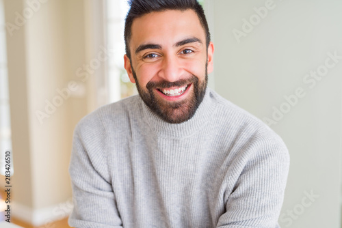 Handsome man smiling cheerful with a big smile on face showing teeth, positive and happy expression © Krakenimages.com