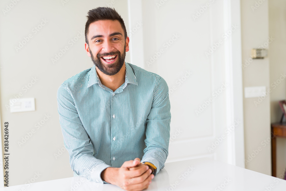 Fototapeta premium Handsome man smiling cheerful with a big smile on face showing teeth, positive and happy expression