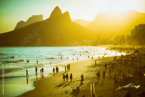 Scenic sunset view of Ipanema Beach on a busy summer afternoon in Rio de Janeiro, Brazil