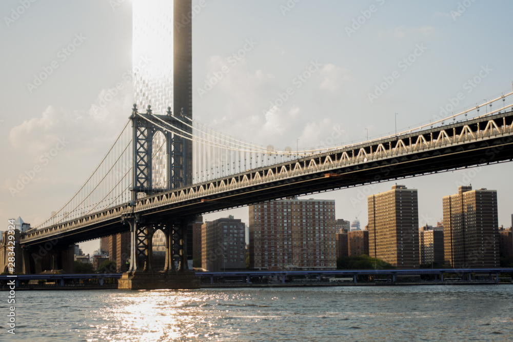 Manhattan Bridge with sun reflection