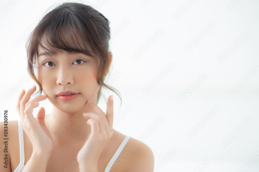 Portrait beautiful asian woman makeup of cosmetic, girl hand touch cheek and smile attractive, face beauty perfect with wellness in the bedroom at home with skin care and healthcare concept. Portrait beautiful asian woman makeup of cosmetic, girl hand touch cheek and smile attractive, face beauty perfect with wellness in the bedroom at home with skin care and healthcare concept.