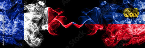 France vs Liechtenstein, Liechtensteins smoky mystic flags placed side by side. Thick colored silky abstract smoke banner of French and Liechtenstein, Liechtensteins photo