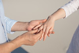 Close-up man and woman hand touching holding together on blurred background for love and healing concept