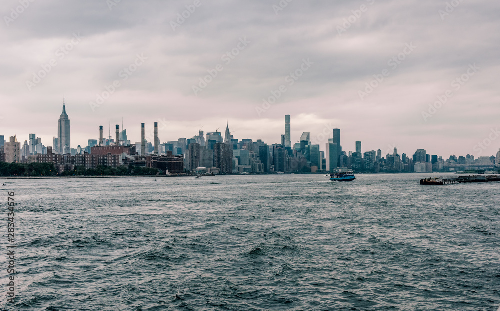 View on Manhattan midtown from Domino Park in Williamsburg, Brooklyn