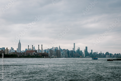 View on Manhattan midtown from Domino Park in Williamsburg  Brooklyn