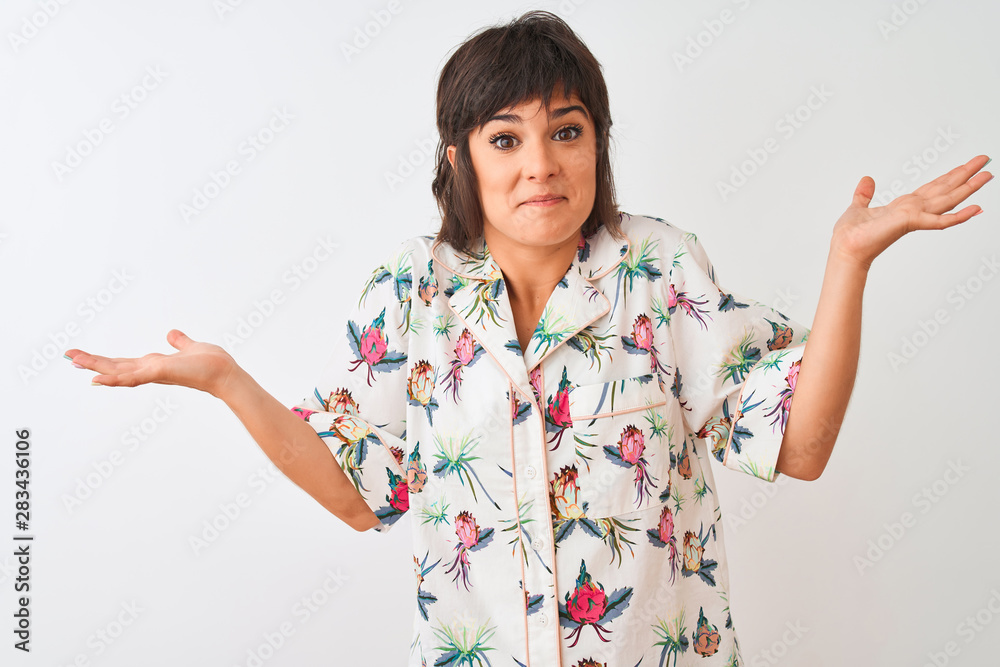 Beautiful woman on vacation wearing summer casual shirt over isolated white background clueless and confused expression with arms and hands raised. Doubt concept. Beautiful woman on vacation wearing summer casual shirt over isolated white background clueless and confused expression with arms and hands raised. Doubt concept.