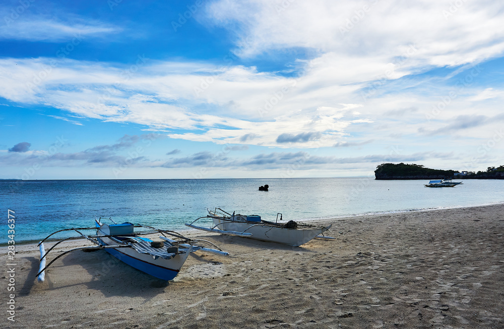 Fototapeta premium Boats at the beach in Malapascua. Philippines