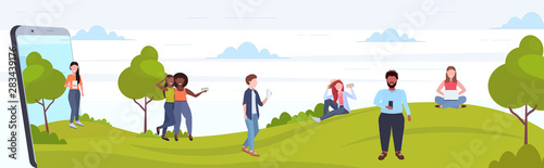 people using cellphones mix race men women walking outdoor having fun digital technology addiction concept smartphone screen mobile app flat full length horizontal