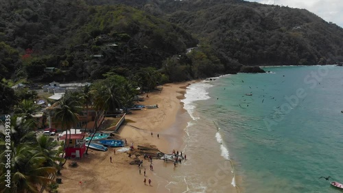 Stunning aerial view of a shoreline with fishermen attending to the dragnet catch