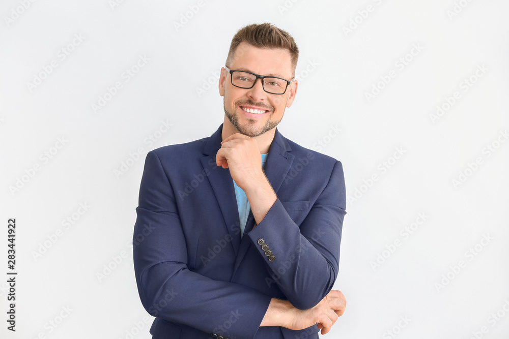Handsome male teacher on light background Handsome male teacher on light background