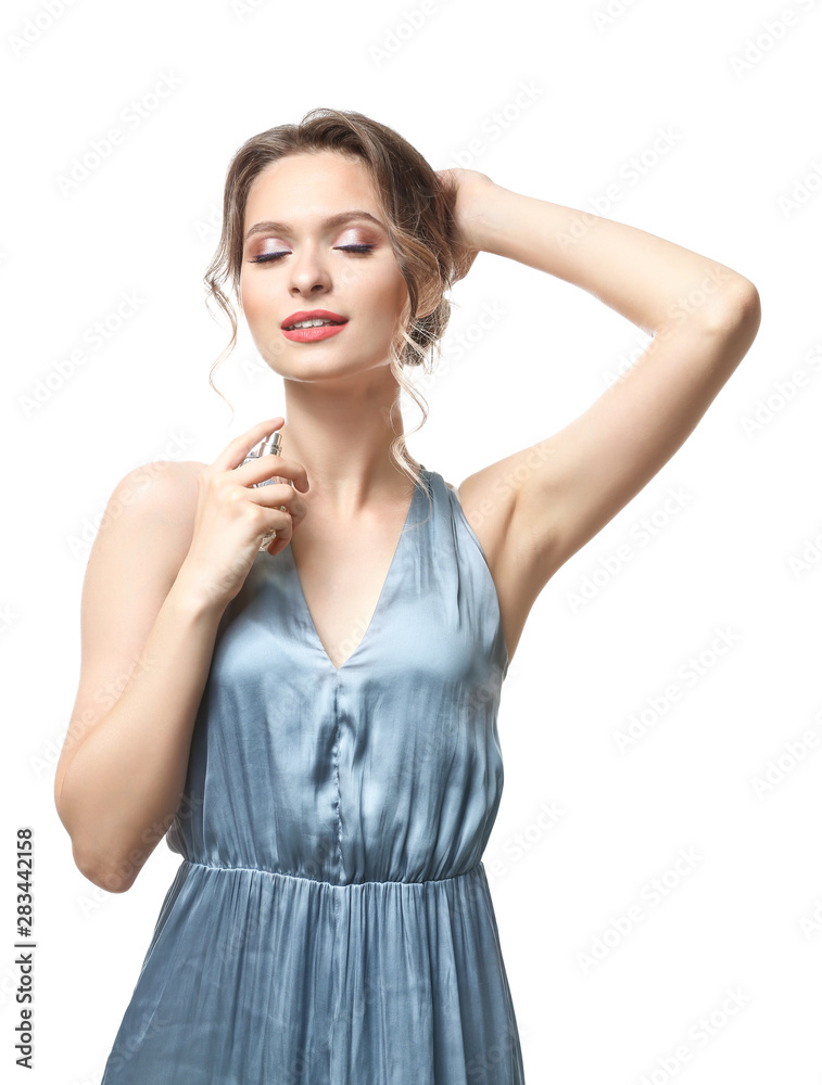 Beautiful young woman with bottle of perfume on white background Beautiful young woman with bottle of perfume on white background
