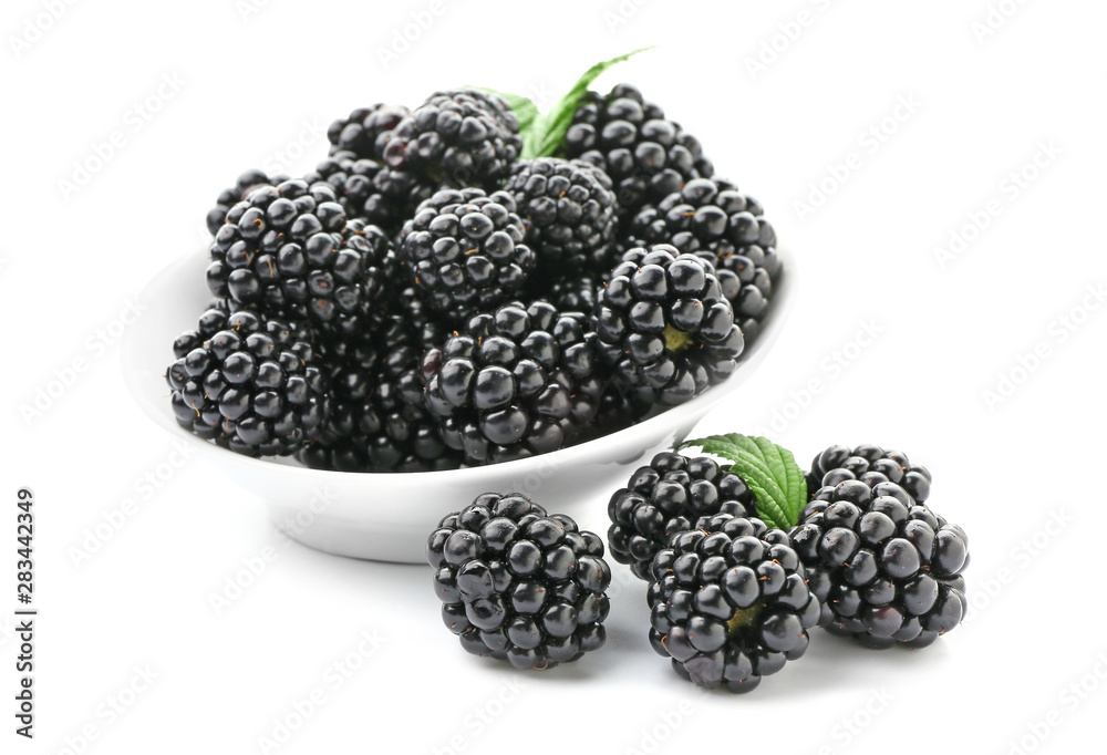 Bowl with ripe blackberry on white background Bowl with ripe blackberry on white background