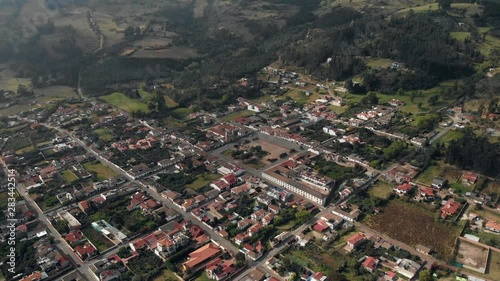 Drone shoot of Tibasosa, Boyaca, Colombia, small colonial town close to the mountains, down town, Colombia town, flying over small town. photo