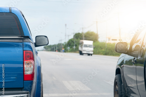 Brake of blue pick up car on asphalt roads for travel or business work.