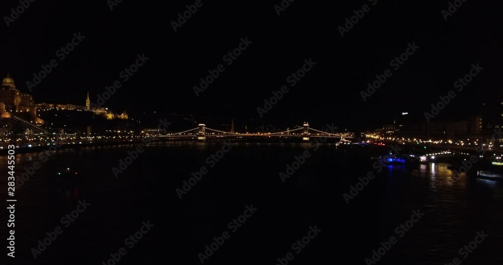 Wide shot of the Szechenyi Chain Bridge in the evening over the Danube river in Budapest. Wide shot of the Szechenyi Chain Bridge in the evening over the Danube river in Budapest.