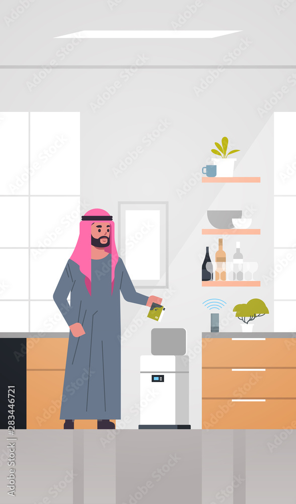 arab man putting trash in electronic recycling bin controlled by smart