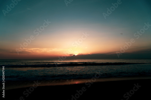 Tropical nature clean beach and white sand in summer with sun light blue sky and bokeh background.