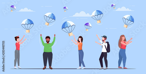 people catching parcel boxes falling down with parachute from sky transportation shipping package air mail express postal delivery concept full length flat horizontal