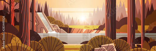 beautiful waterfall over rocky cliff yellow autumn forest nature landscape sunset background flat horizontal