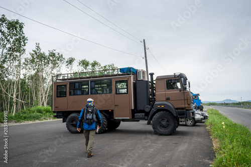 Yelizovo, Kamchatka / Russia - July 27 2019: Brown new KAMAZ, six wheel off road all terrain vehicle of Russian origin, reliable transport in harsh road conditions. Car waiting for tourists photo