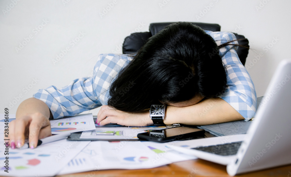 Women sleep on the office desk in the office. Women sleep on the office desk in the office.