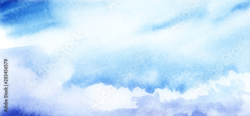 Blue sky with cumulus white clouds. Abstract watercolor background with blur effect. Hand drawn illustration on texture paper.