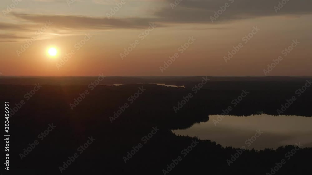 Sunset view. Drone shot of landscape with lake. Golden sky and horizon. Reflection in the water. Nature. Dark. Sunset view. Drone shot of landscape with lake. Golden sky and horizon. Reflection in the water. Nature. Dark.
