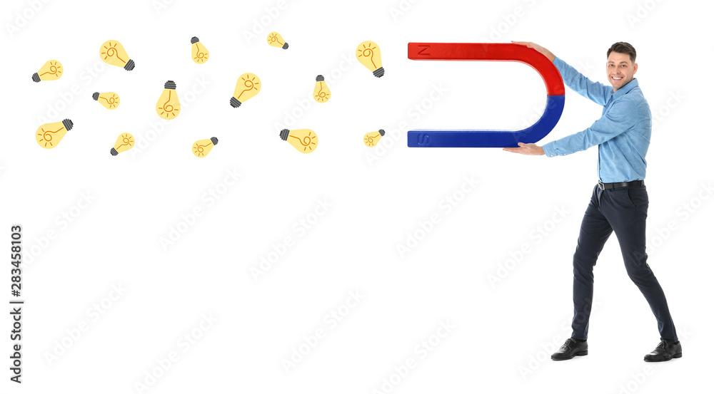 Man attracting ideas in form of light bulbs with magnet on white background. Creative design Man attracting ideas in form of light bulbs with magnet on white background. Creative design