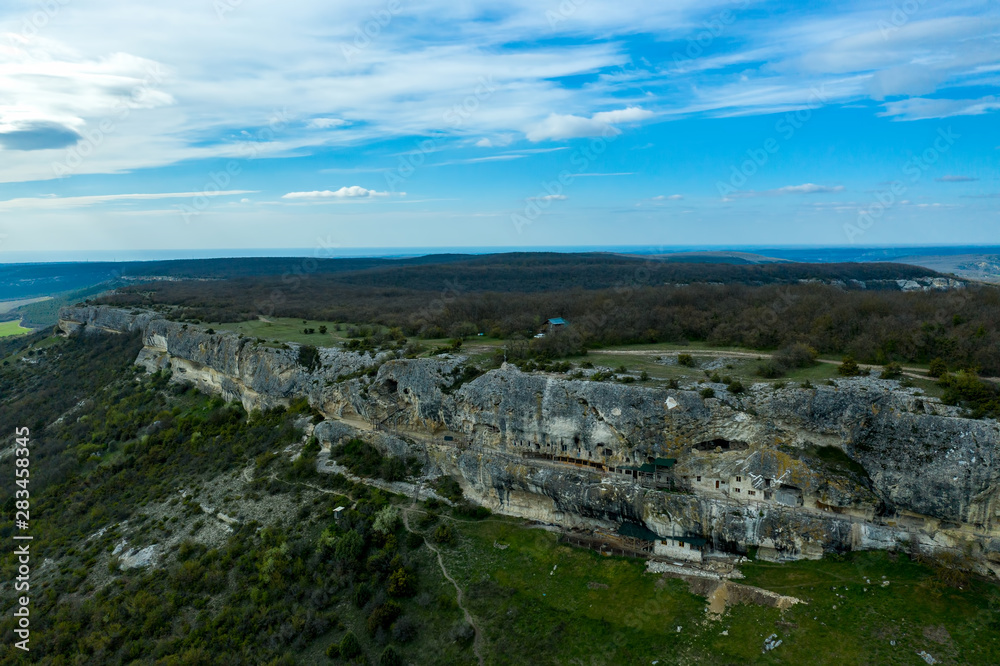 Flying drone above the cave city and monastery Chelter-Marmara, near the city of Bakhchisaray, Crimea